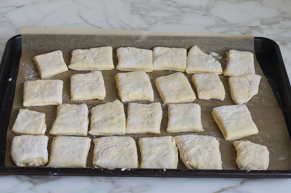 Pieces of dough on a baking sheet.