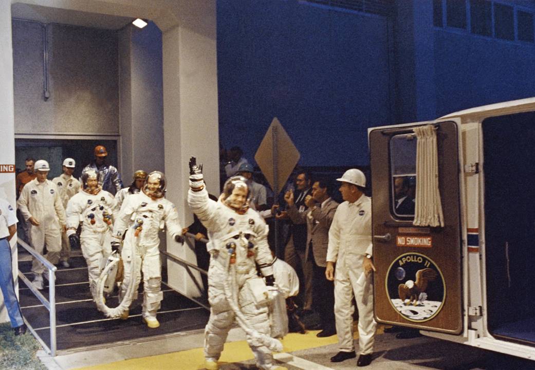 The astronauts make their way to the Saturn V rocket 