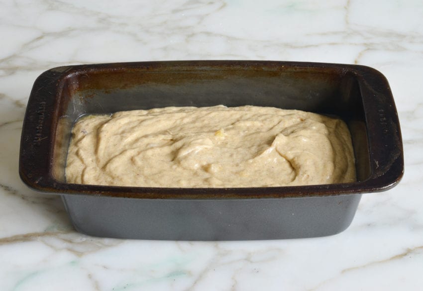Loaf pan of chai-spiced banana bread dough.
