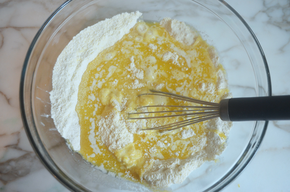 Whisk mixing wet and dry ingredients.