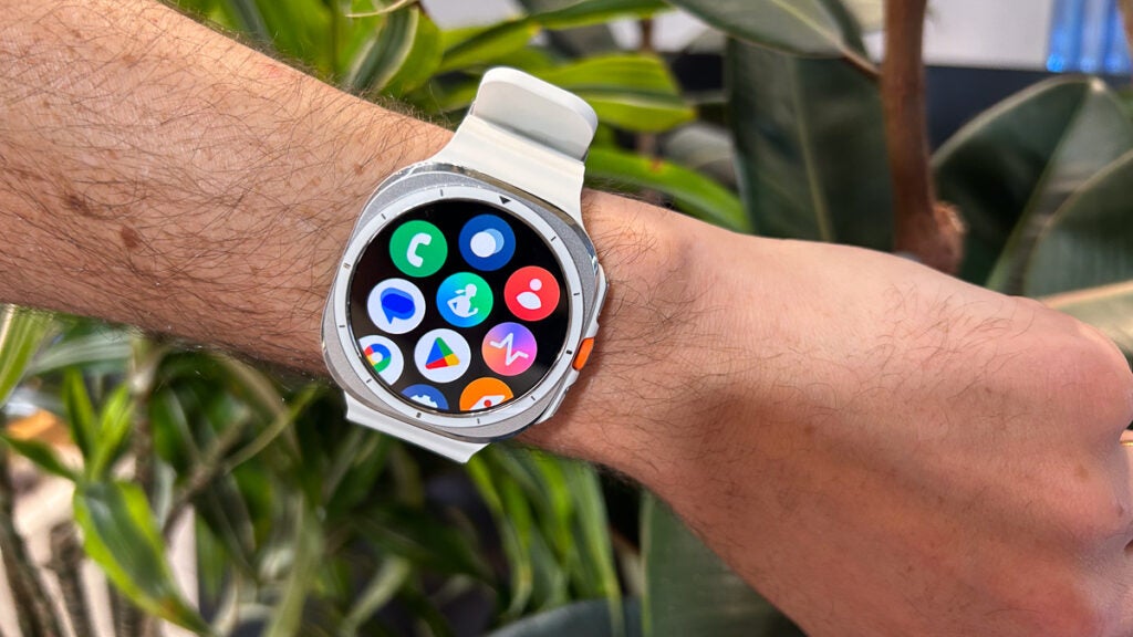 Samsung Galaxy Watch Ultra on wrist in white and silver app grid