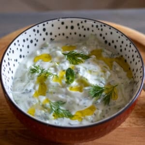 cacik is usually garnished with fresh mint and dill