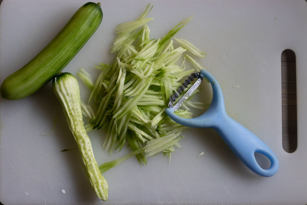 cucumber is julienned with a peeler