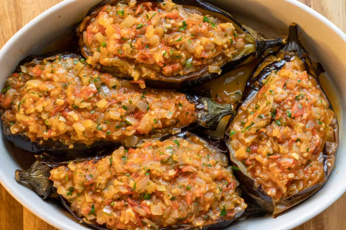Aubergines are stuffed with the onions and tomato mixture
