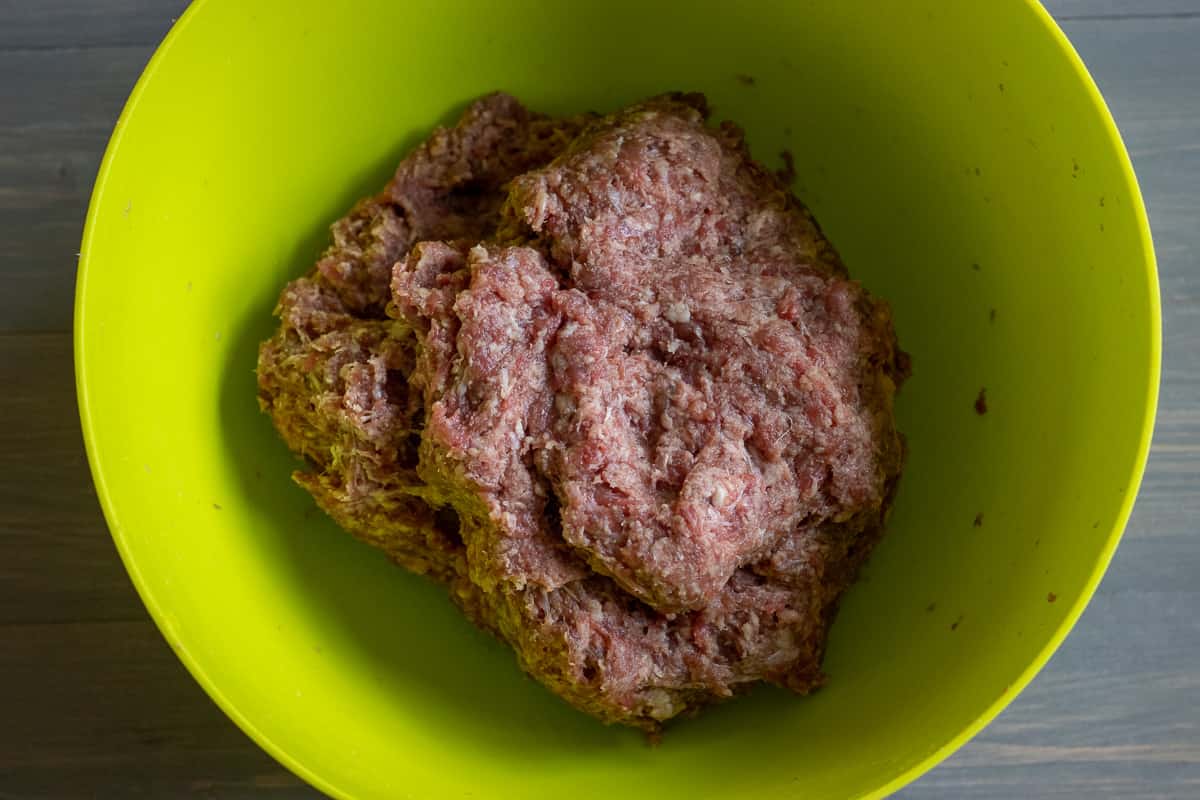 ground beef is mixed with breadcrumbs and water