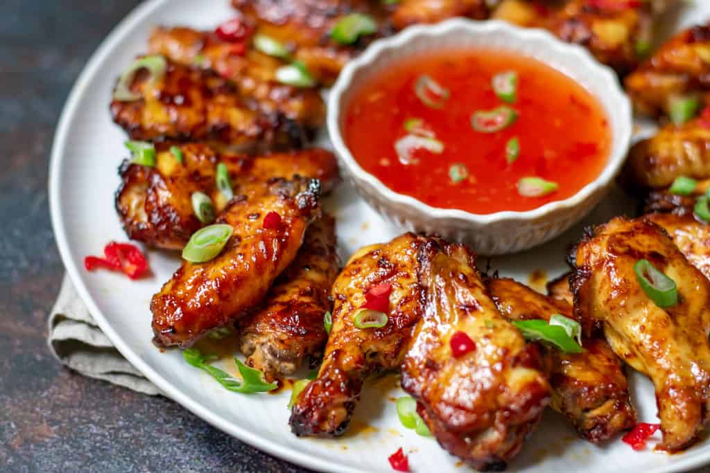 easy spicy chicken wings served with chili sauce dipping