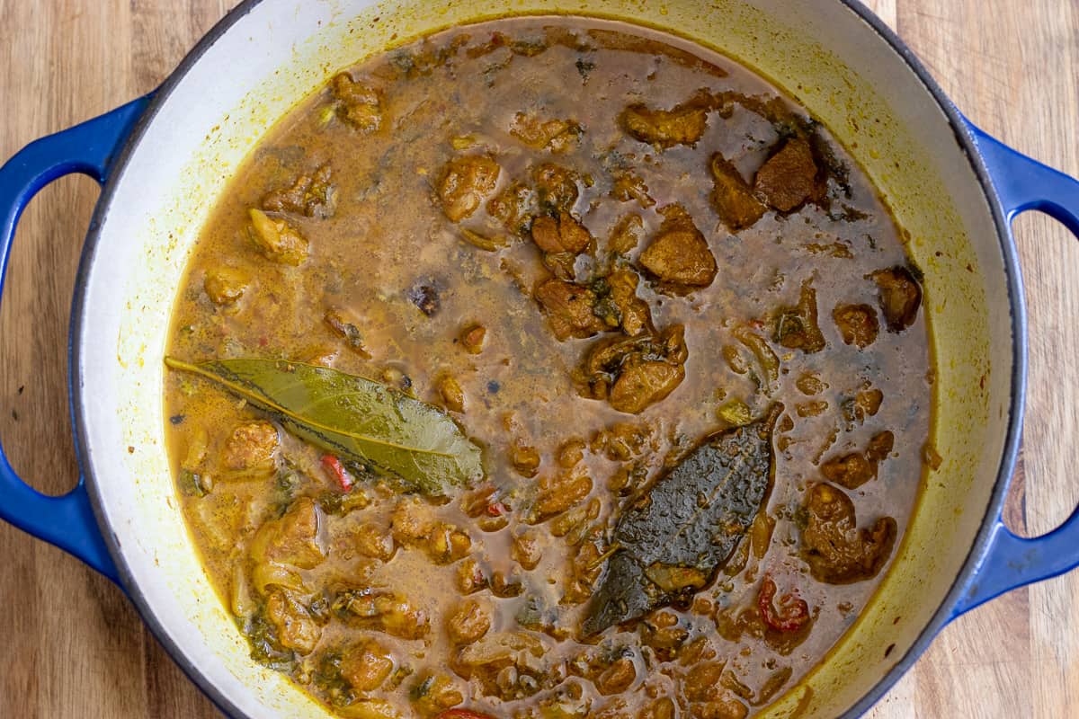 the curry is cooked until the mutton is tender