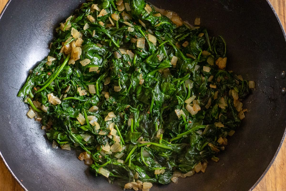 spinach is sautéed with onions