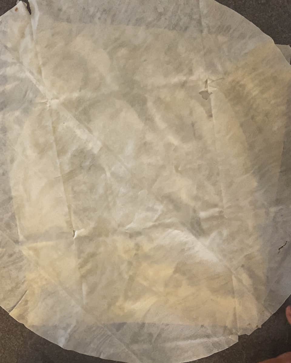 second yufka sheet is layered on potato filling