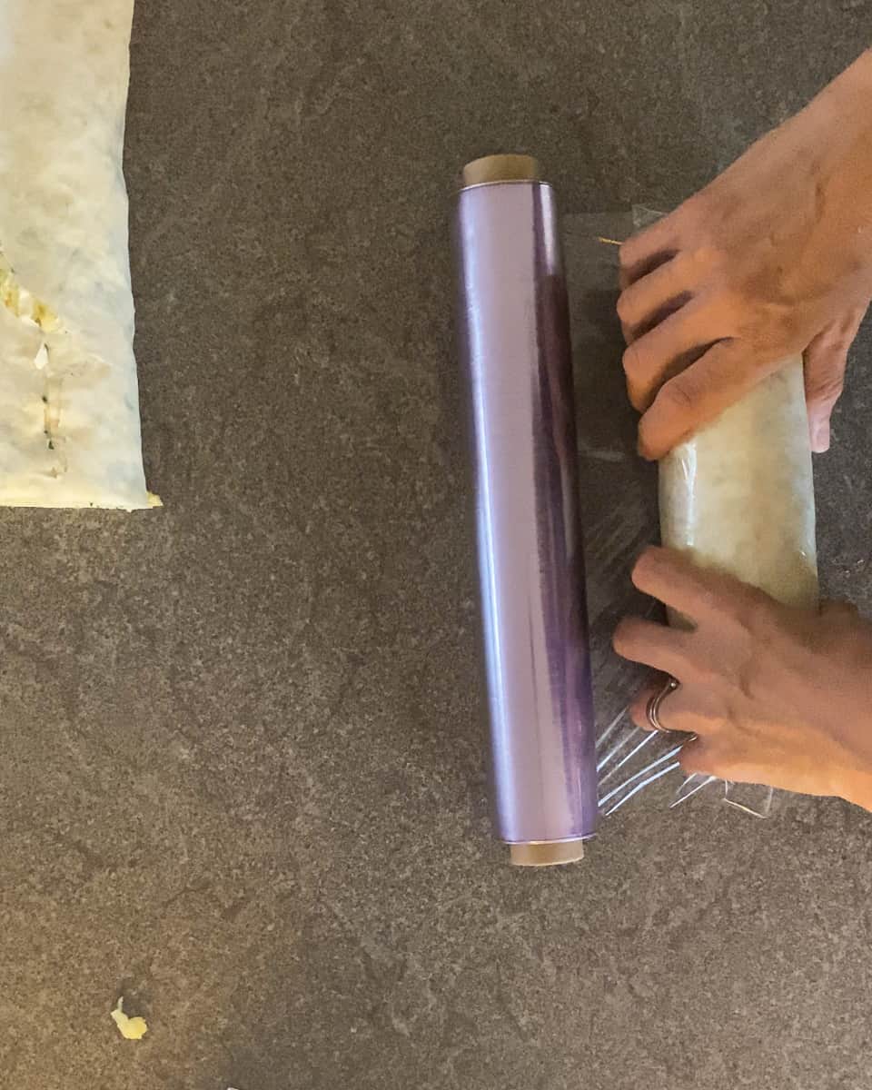 Wrapping the borek into a cling film.