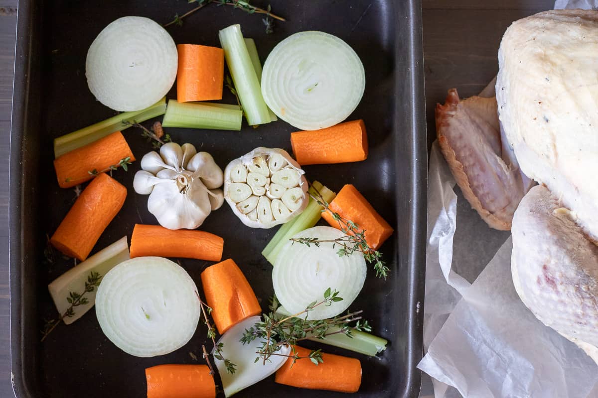 the vegetables are layered on the bottom of baking tray