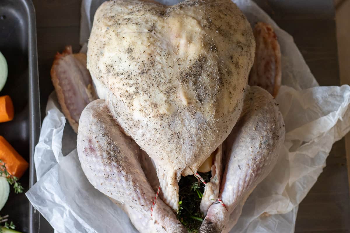 the rest of the softened butter is spread on turkey breast
