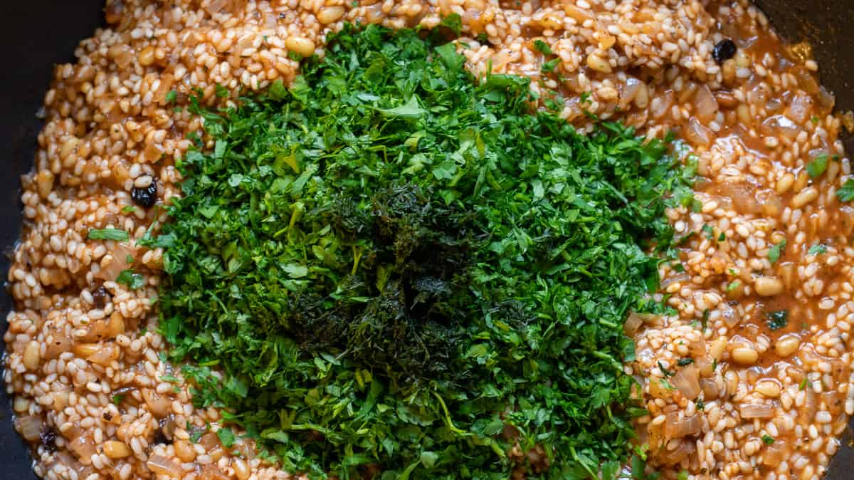 chopped parsley is added to the rice filling