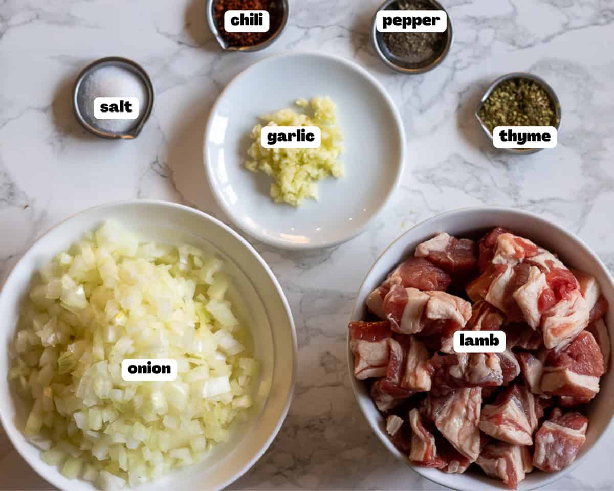 Labelled picture of ingredients for elbasan tava lamb stew