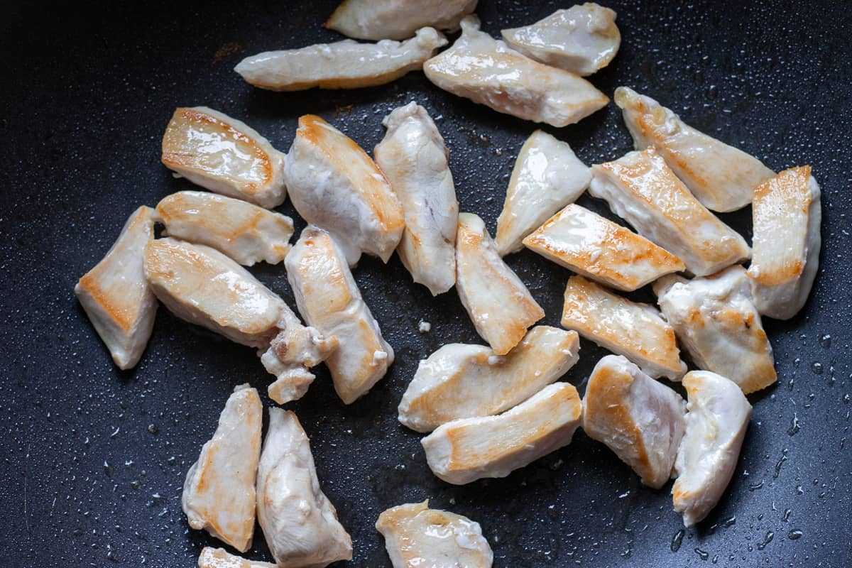 browning the chicken pieces with olive oil 