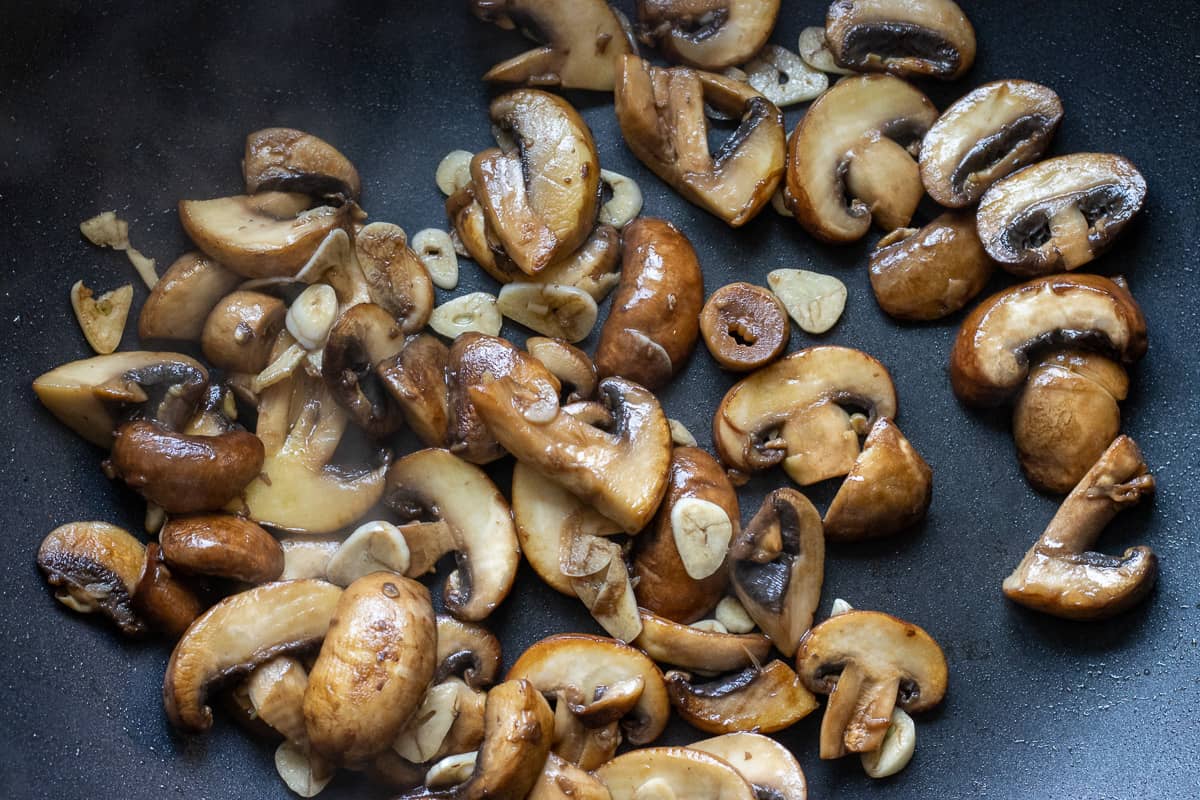 Sautéing the mushrooms and garlic