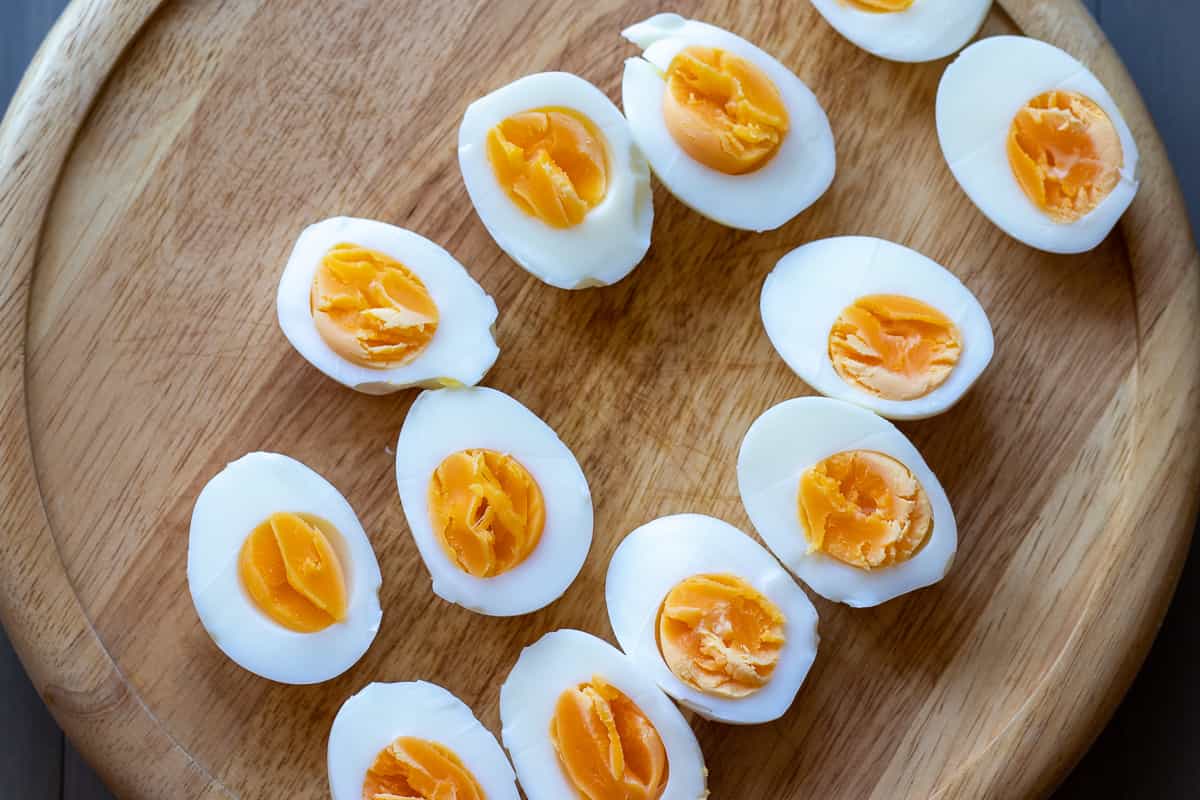 peeled hard boiled eggs are cut in halves