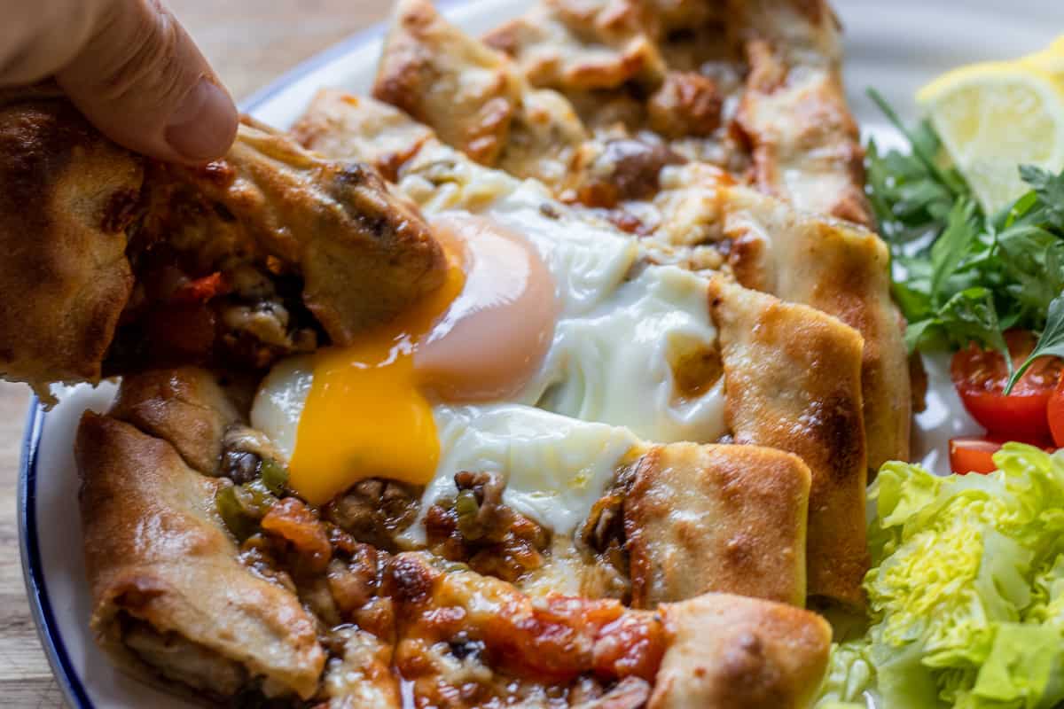 mushroom pide topped with an egg