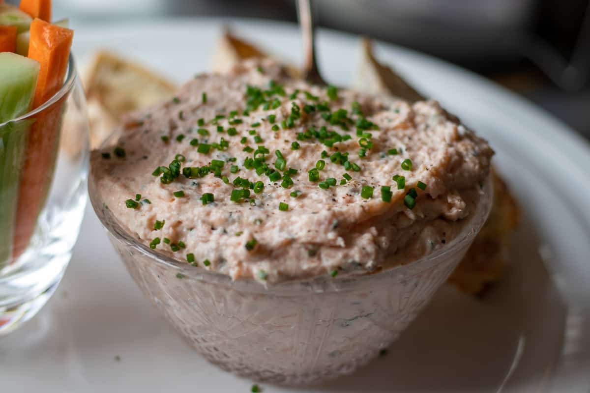 smokes salmon pate is transferred into a serving bowl