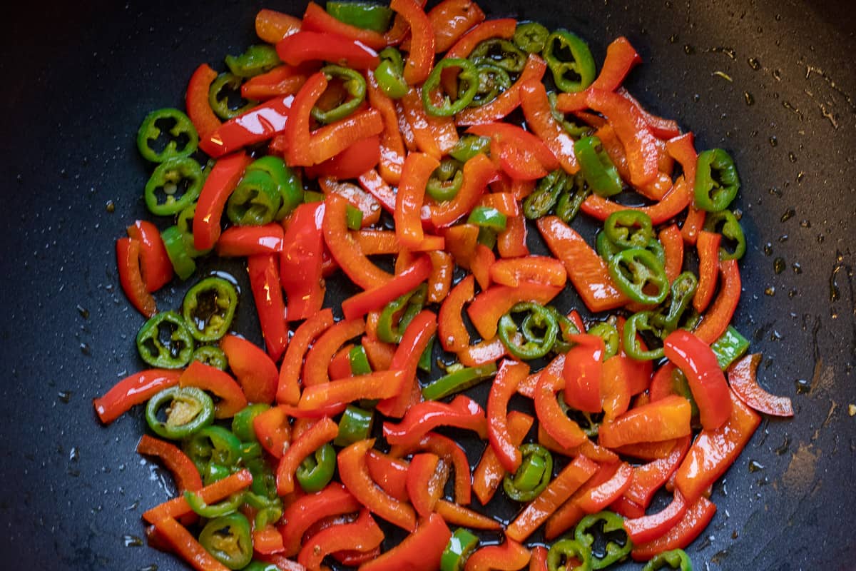 sautéing the peppers in a pan with butter &olive oil