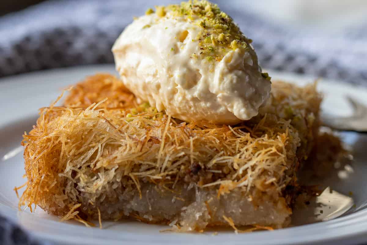 tel kadayif served with ice cream and chopped pistachio