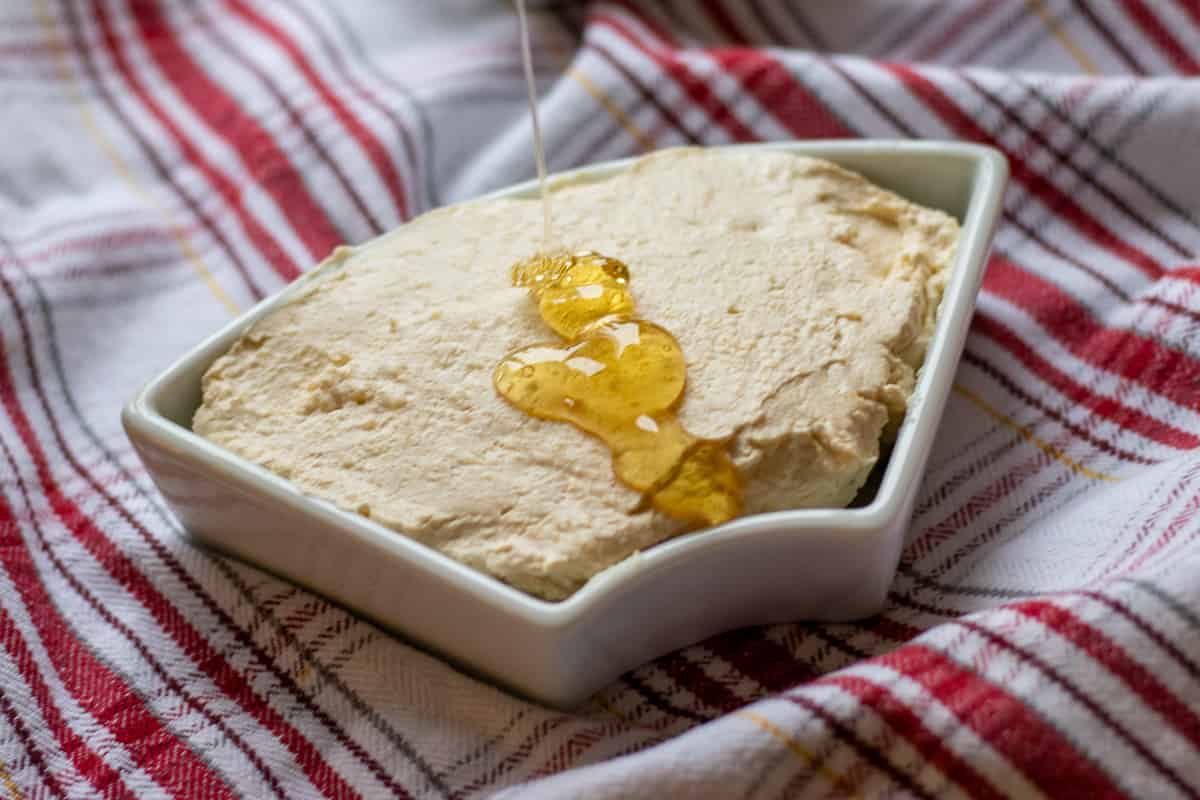 turkish kaymak  -geymar is placed on a bowl and served with honey