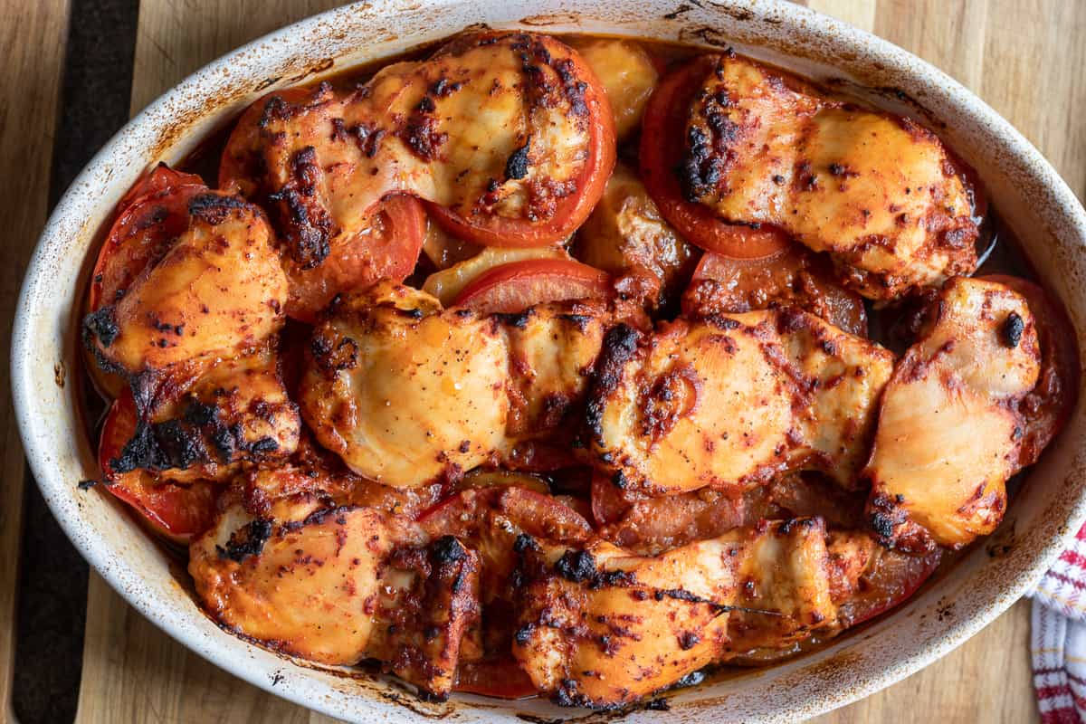 The dish is baked until the chicken thighs are charred