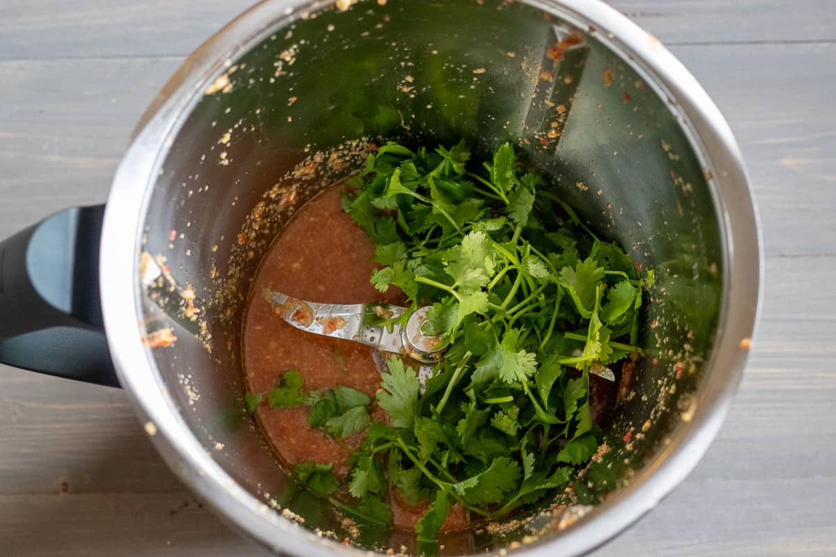 the coriander leaves are added to the blitzed dressing