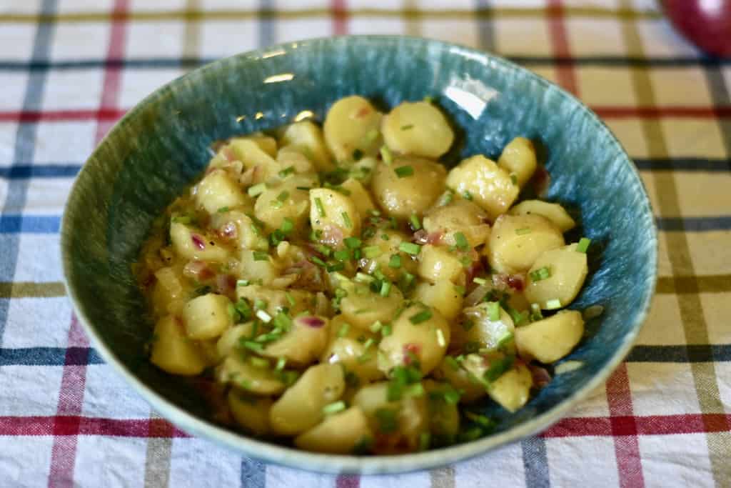 warm potato salad served in a bowl