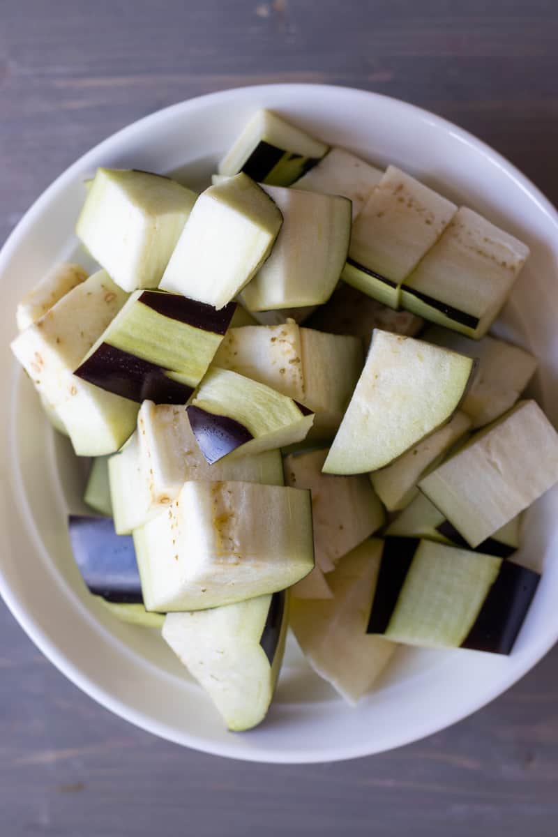 aubergines are peeled and cut in cubes