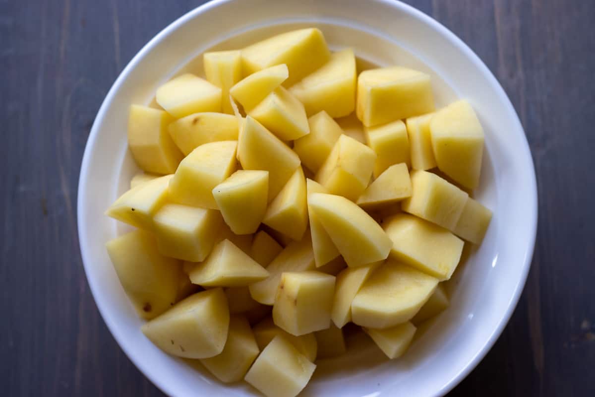 potatoes are peeled and cut in cubes