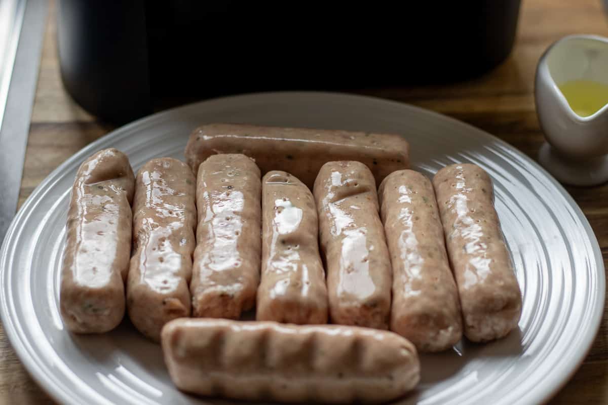 sausages removed from packaging and placed on a plate