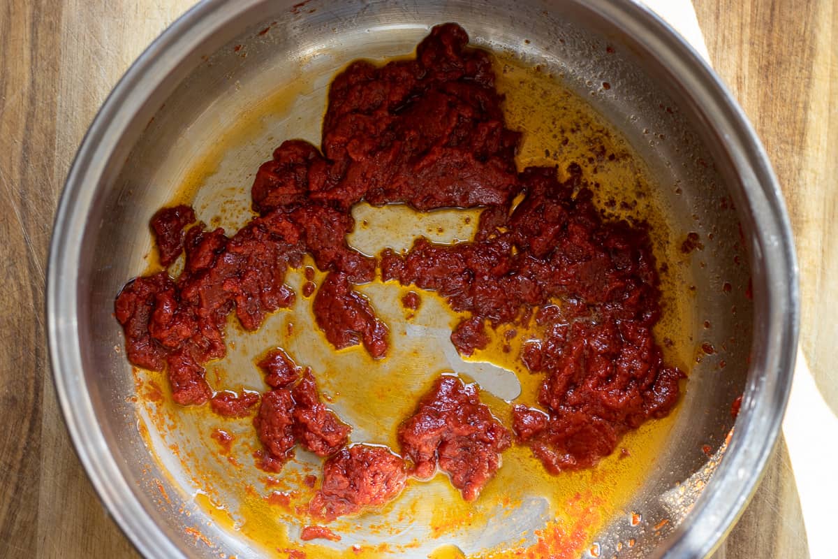 sautéing the pepper paste with butter in a pan