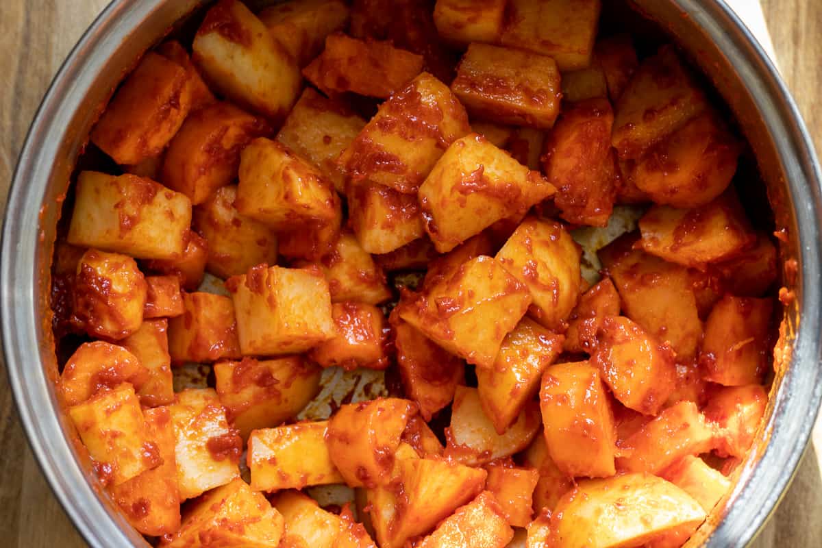 potatoes and carrots are added to the pan
