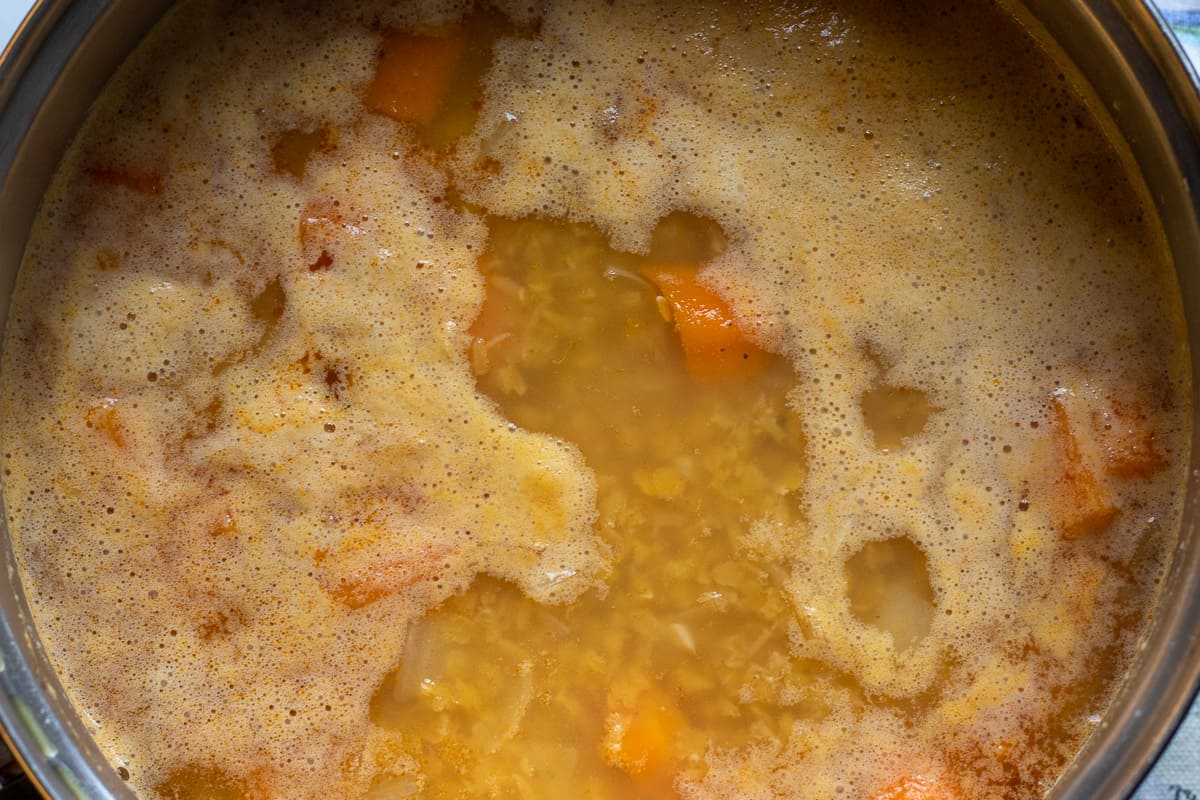 lentil soup is cooked until the carrots are softened