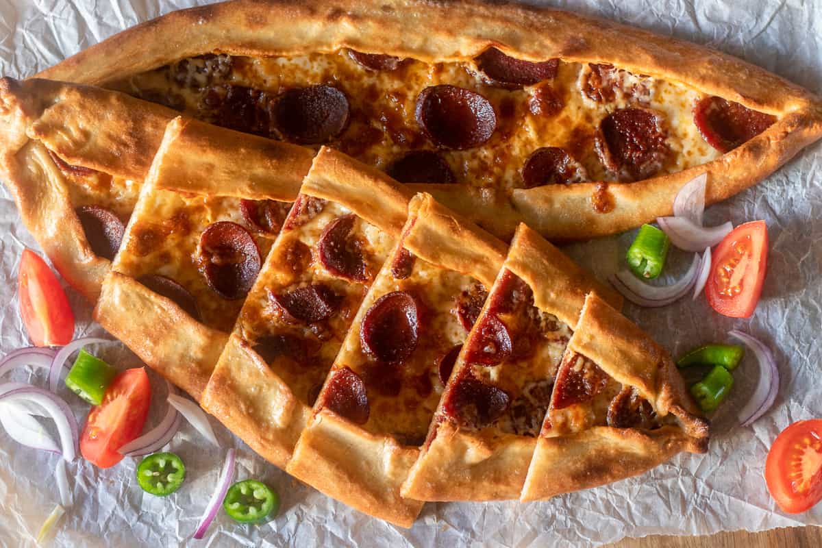 freshly baked sucuklu pide (Turkish Bread with Spicy Sausage)