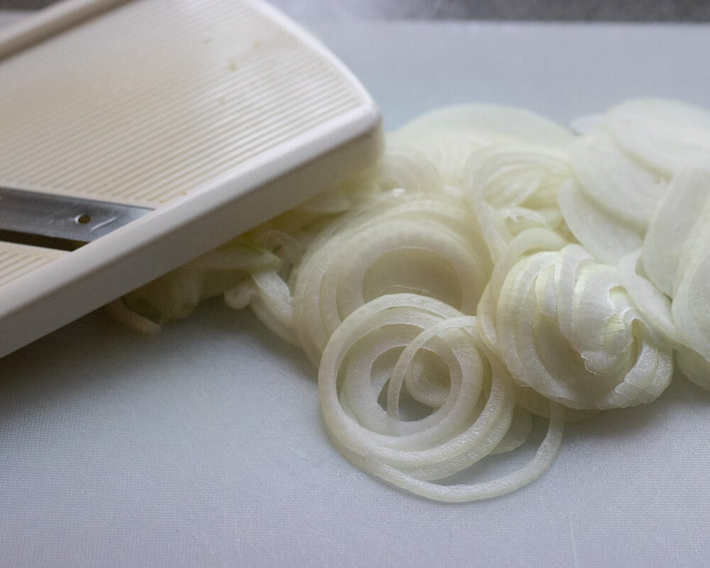 onions are sliced with a mandolin