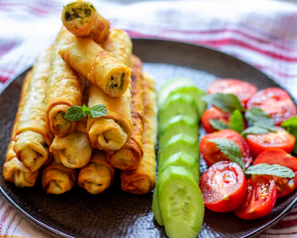 sigara borek-Turkish cheese rolls served with cucumbers and tomatoes