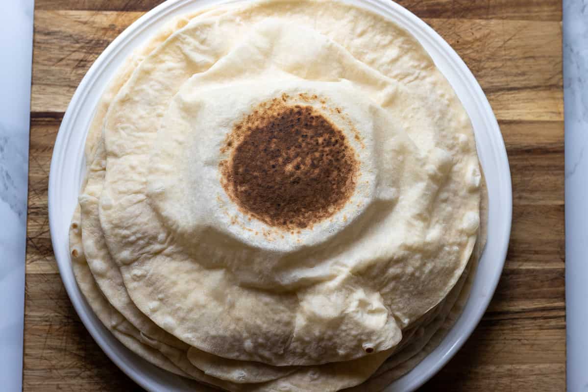 Middle Eastern lavash bread is placed on a plate 