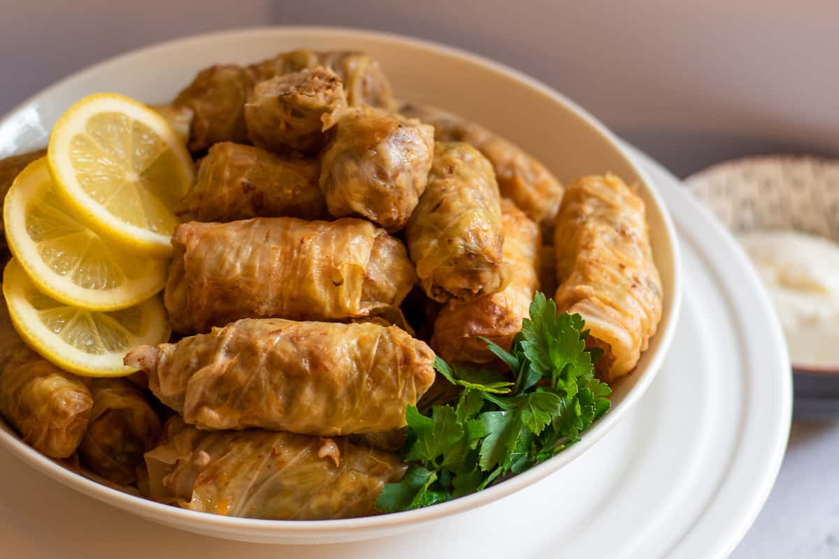 Lahana Sarmasi turkish cabbage rolls served with yoghurt