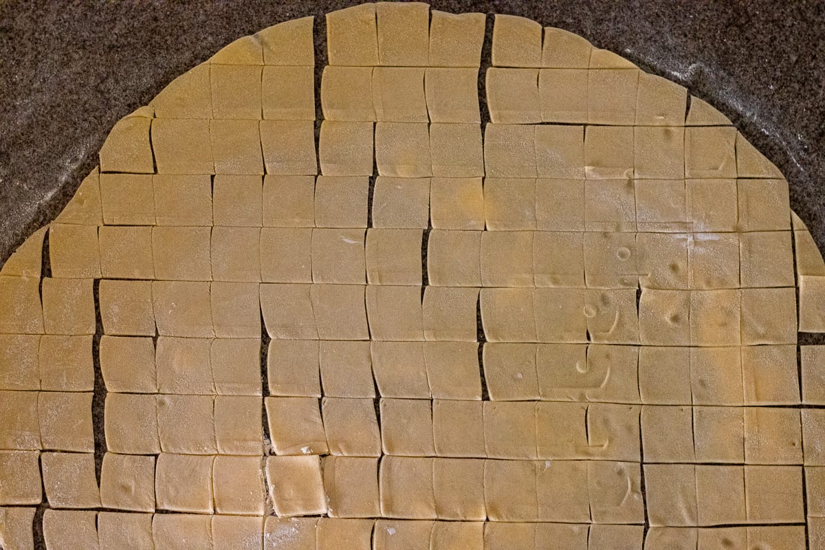 the dough circle is cut into 3 cm squares