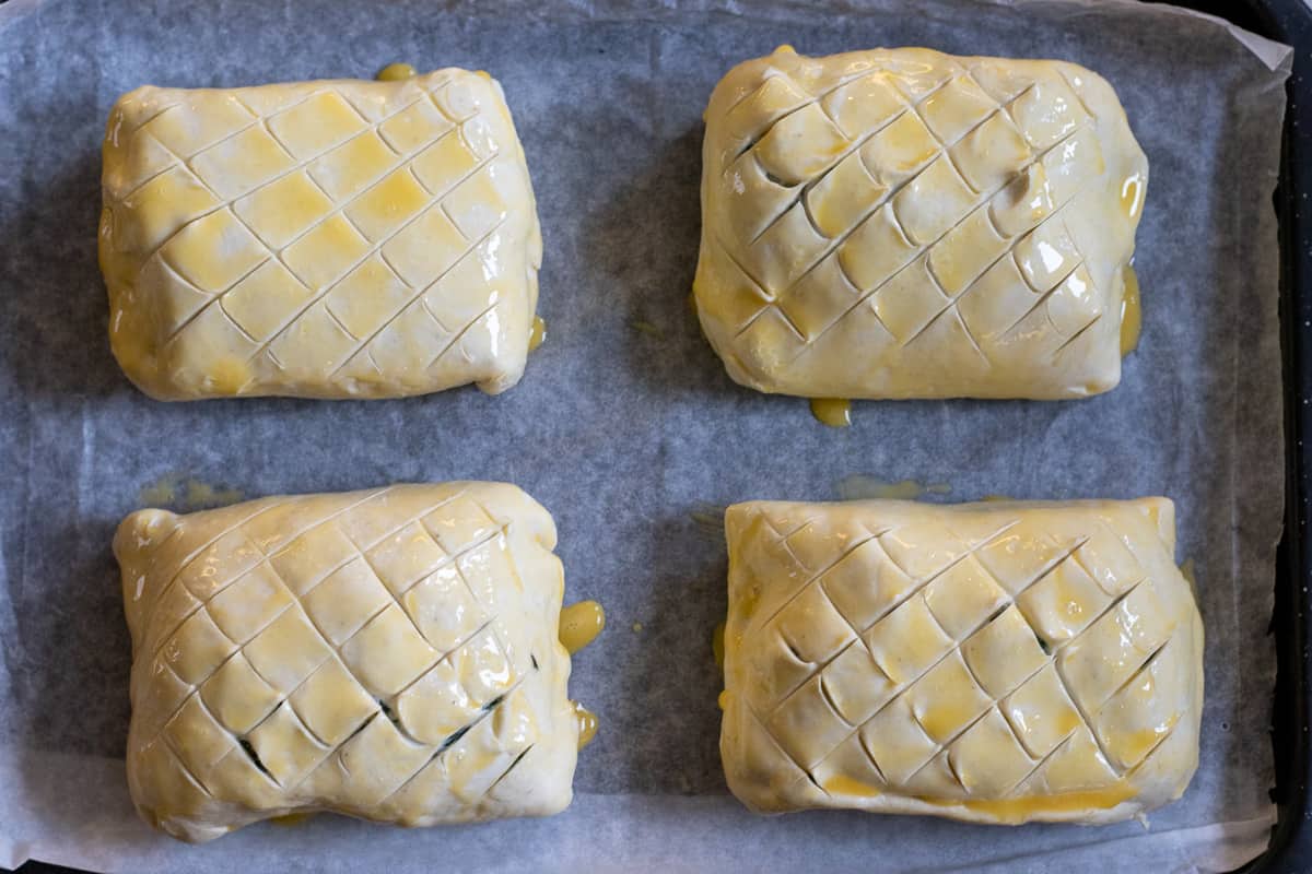 salmon parcels are egg washed before baking