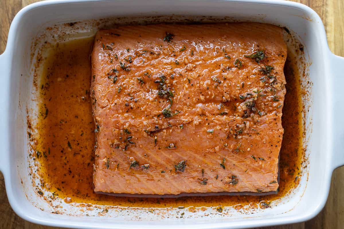 salmon fillet is covered with Mediterranean flavoured marinade
