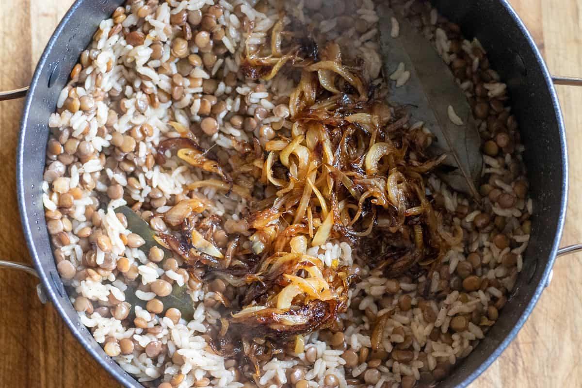 caramelised onions are added to cooked lentils and rice