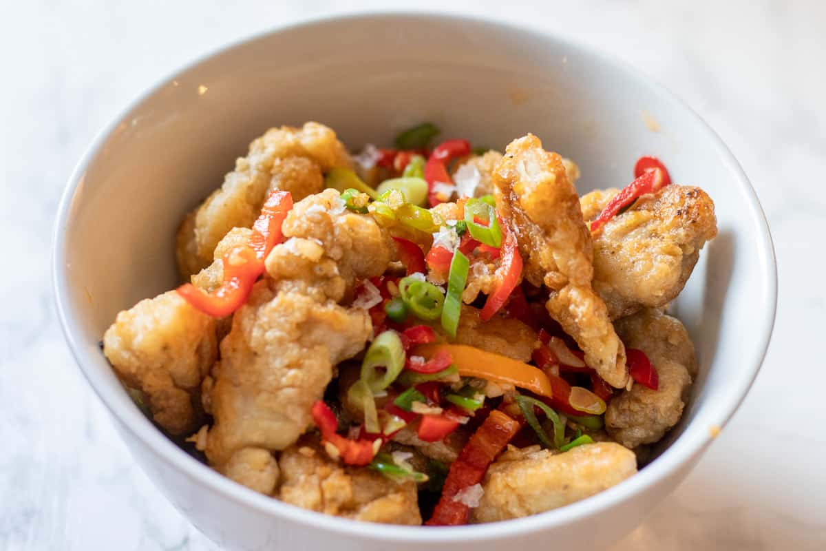 salt and pepper chicken served in a bowl as a finger food