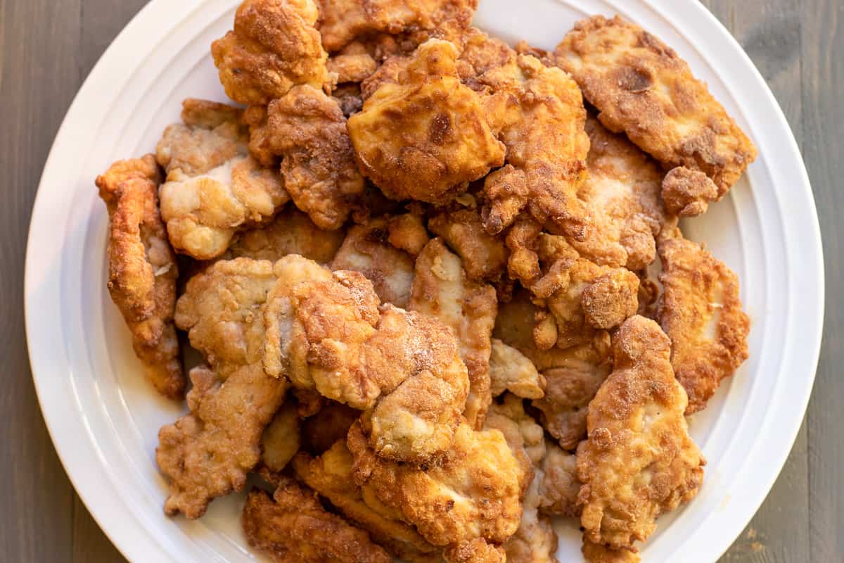 chicken pieces are fried until golden and crispy