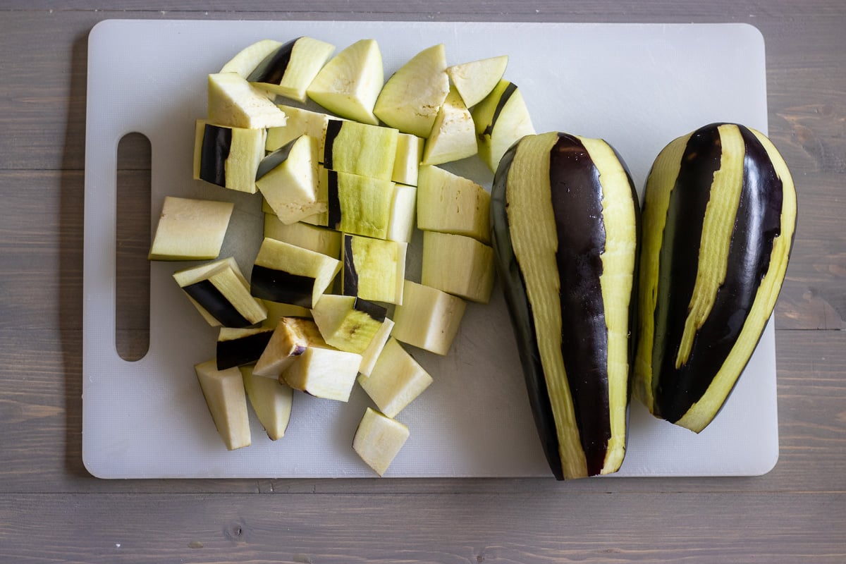 eggplants are peeled in zebra pattern and cut into cubes for making Vegan Lebanese Eggplant Moussaka (Maghmour)