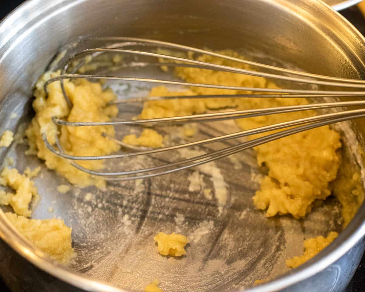 Mix the flour with melted butter for béchamel sauce.