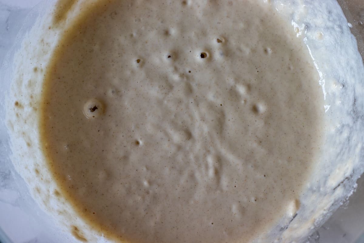 The yeast and water are mixed in a glass bowl