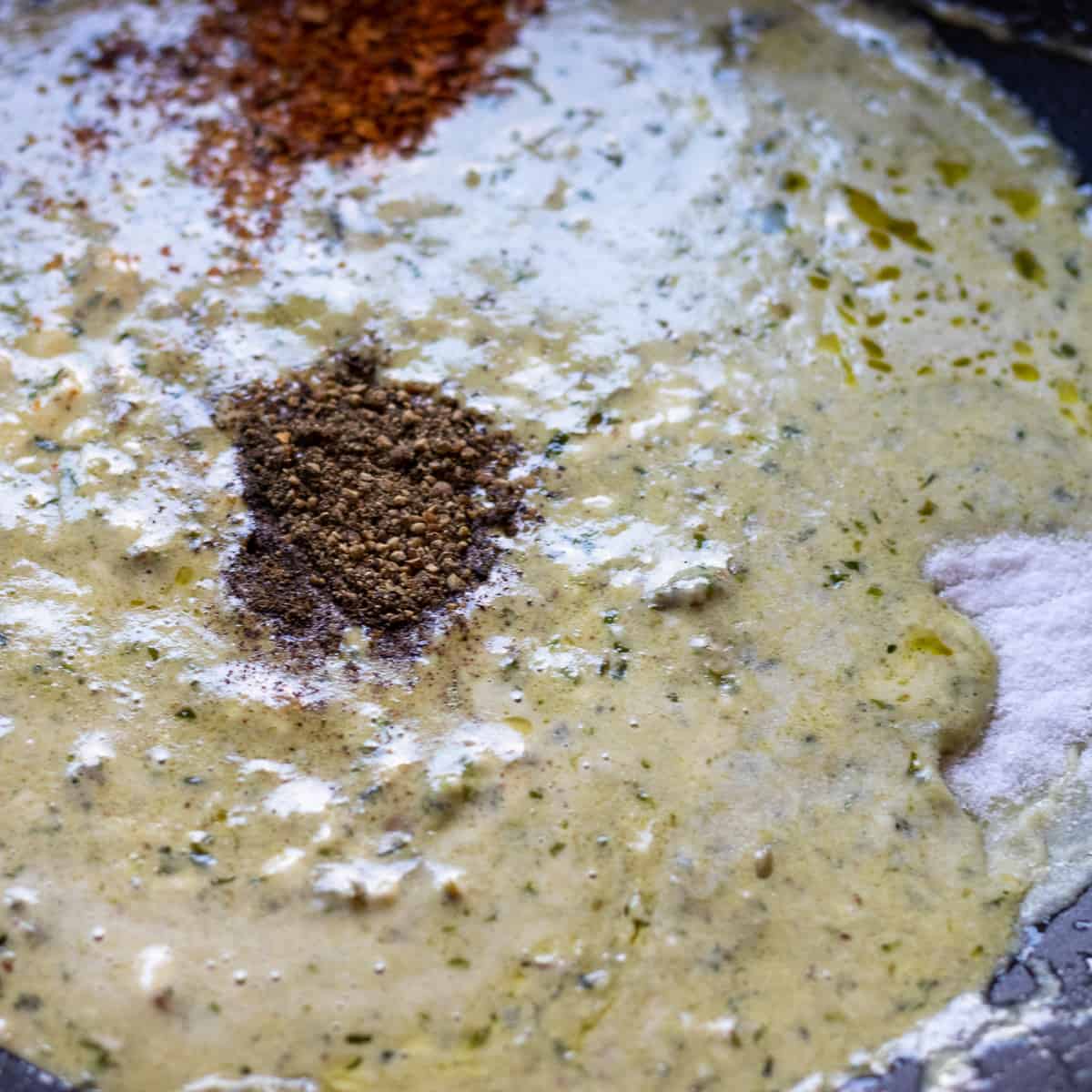 cream, mascarpone, parmesan, blue cheese and seasoning are added to the wok